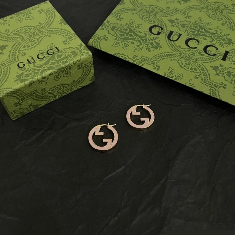 G*u*i earrings